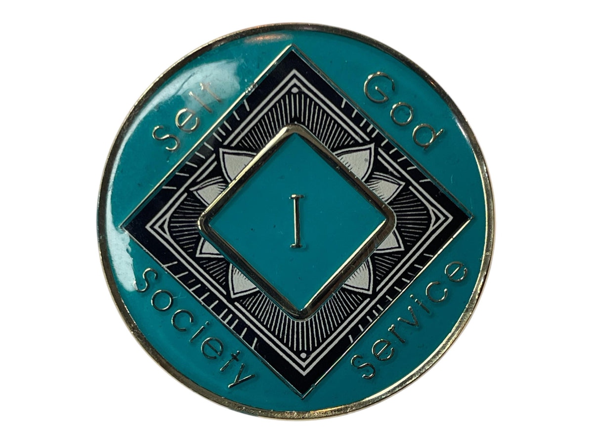 Narcotics Anonymous teal 1-year recovery medallion featuring a black and white lotus flower design symbolizing renewal and spiritual awakening, with “Self, God, Society, Service” engraved around the border to represent balance and growth in sobriety.