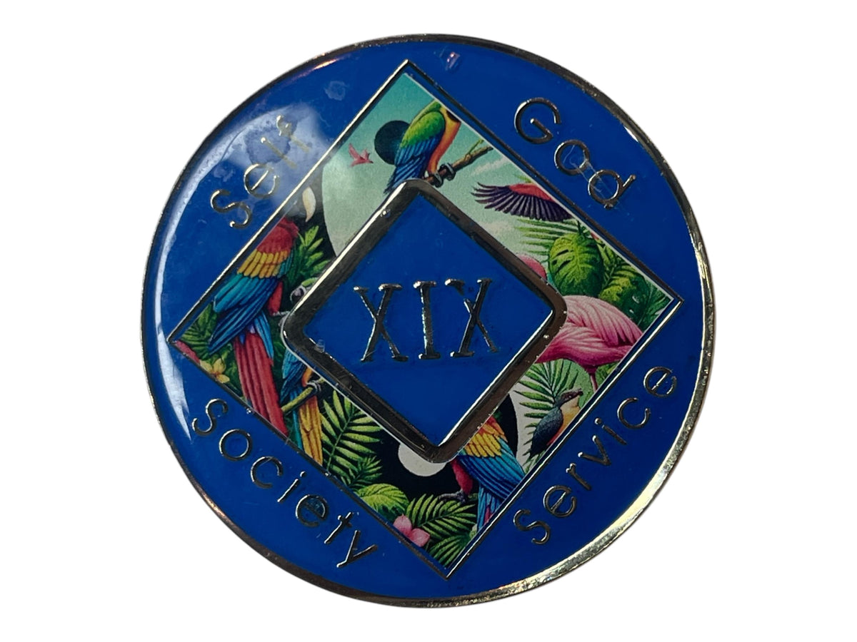 Narcotics Anonymous 19-year recovery medallion featuring a vibrant tropical rainforest scene with colorful parrots, toucan, and flamingo, symbolizing freedom, serenity, and spiritual growth through self, God, society, and service.