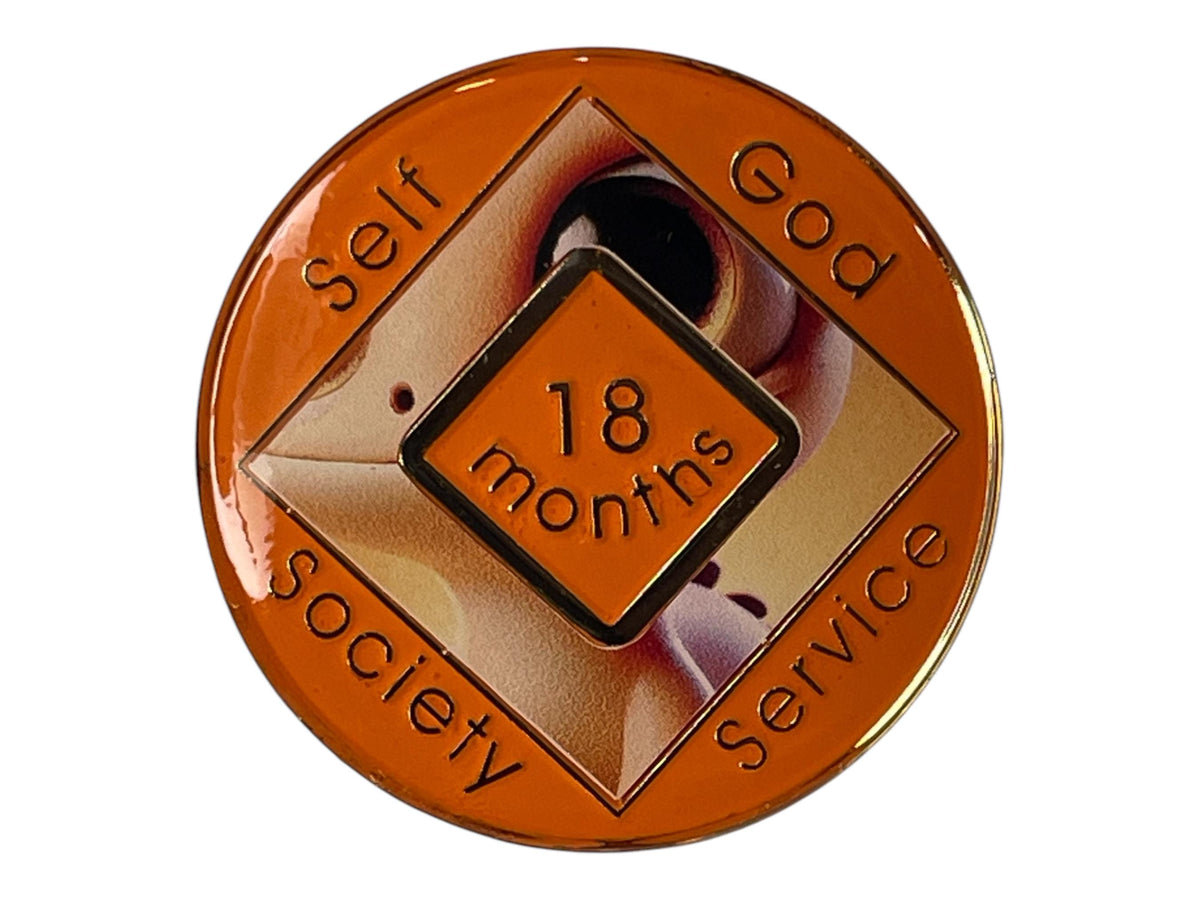 Narcotics Anonymous orange 18-month recovery medallion featuring a baby dragon design with the words ‘Self, God, Society, Service,’ symbolizing growth, perseverance, and dedication in addiction recovery.