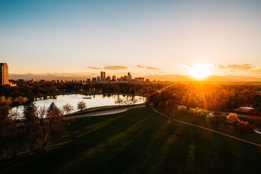 Denver skyline and Rocky Mountains at sunset for the CRCNA XL travel guide