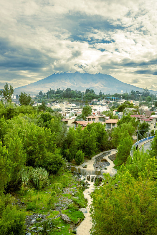 El Misti volcano rising above the green landscape and city of Arequipa, Peru