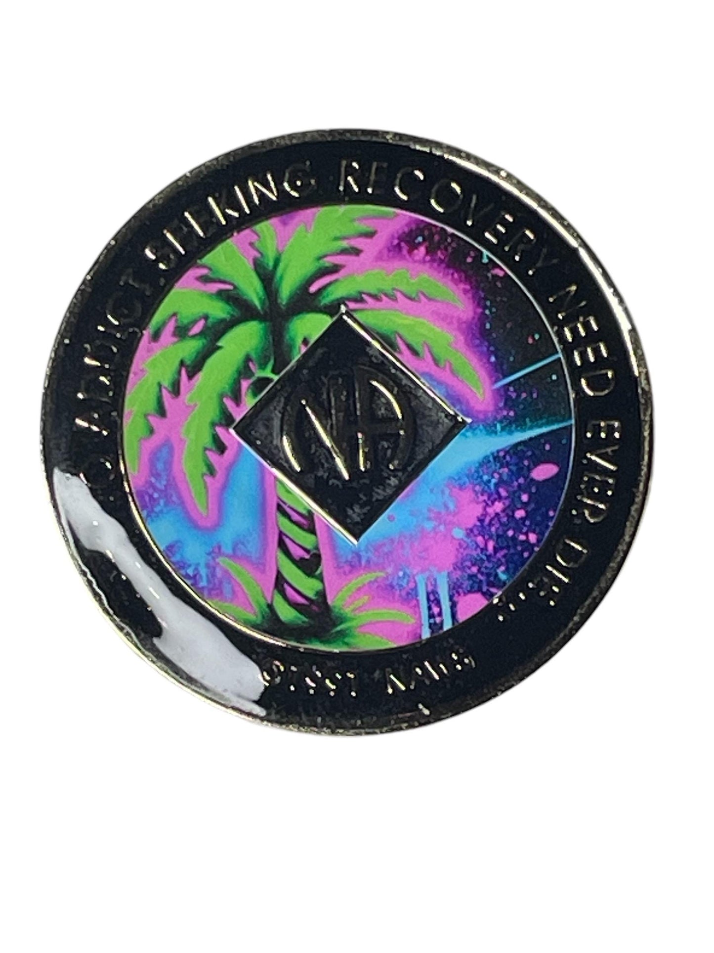 Narcotics Anonymous recovery medallion featuring a neon tropical design with a glowing green palm tree and purple sky, symbolizing peace, renewal, and serenity in recovery.