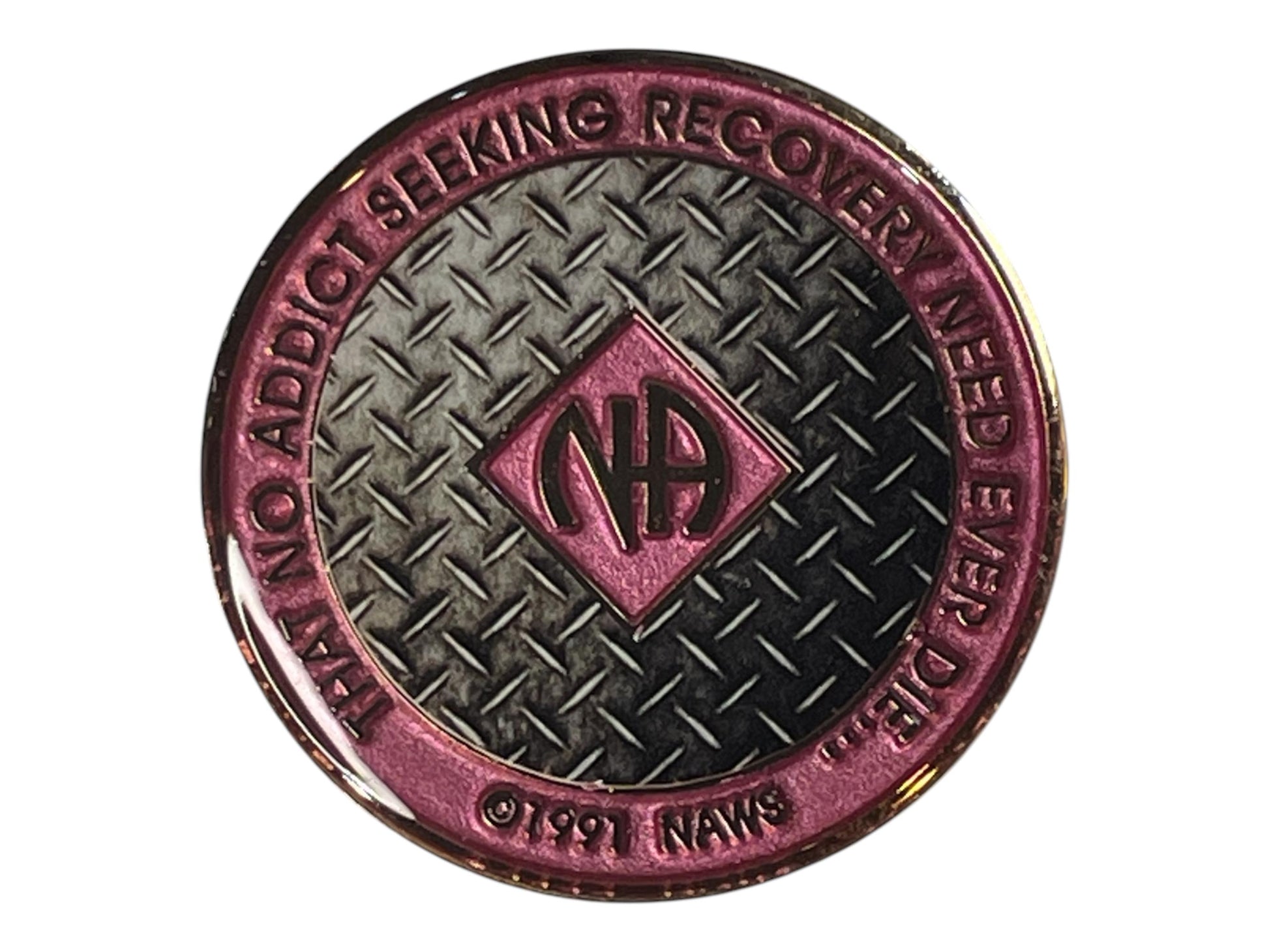Narcotics Anonymous recovery medallion with a pink enamel border and rugged diamond plate steel background. The NA logo is centered, surrounded by the words “That No Addict Seeking Recovery Need Ever Die,” representing strength, perseverance, and commitment to sobriety.