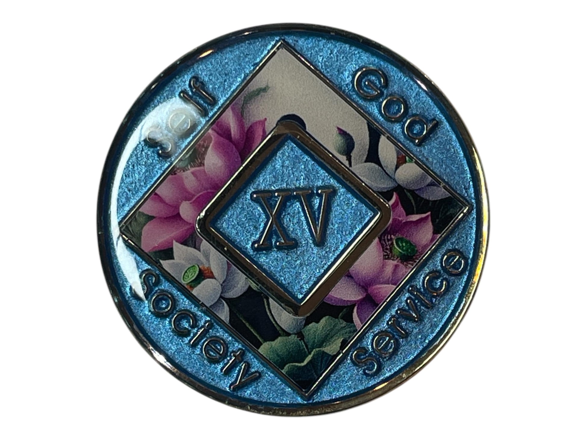 Narcotics Anonymous 15-year sobriety medallion with shimmering blue border, lotus flower background, and the words Self, God, Society, Service surrounding the Roman numeral XV.