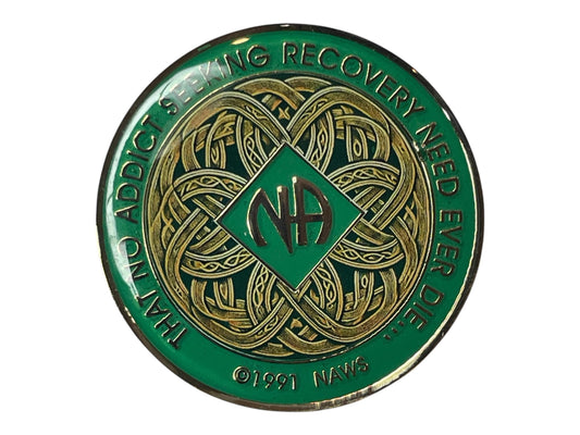 Narcotics Anonymous Celtic knot recovery medallion with green enamel and intricate gold knotwork design, featuring the NA logo in the center and the phrase “That No Addict Seeking Recovery Need Ever Die,” symbolizing unity, connection, and spiritual growth in recovery.