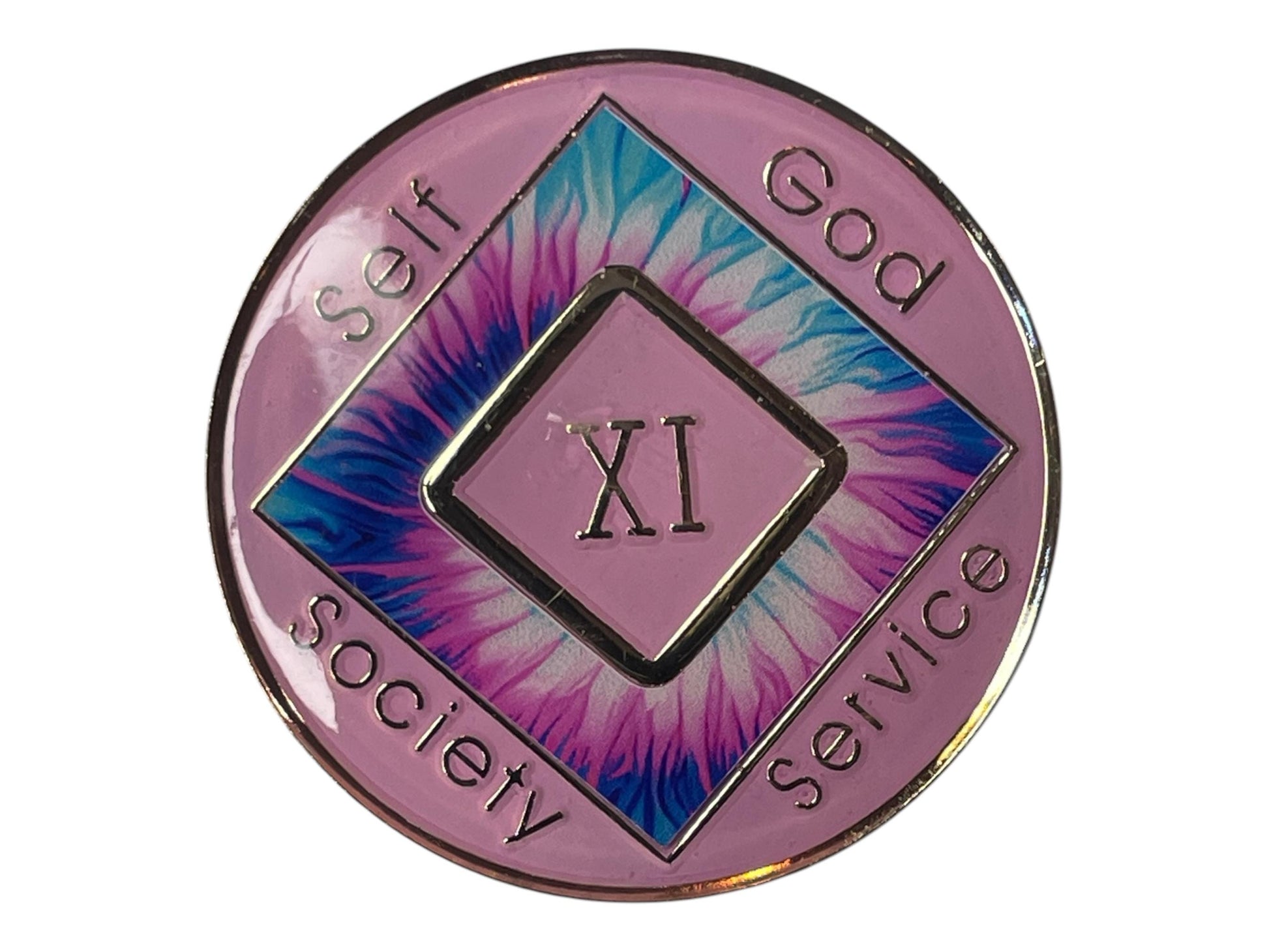 Narcotics Anonymous 11-year pink tie-dye recovery medallion with blue and purple burst pattern, featuring the NA logo and words “Self, God, Society, Service,” symbolizing spiritual growth, unity, and long-term recovery in sobriety.