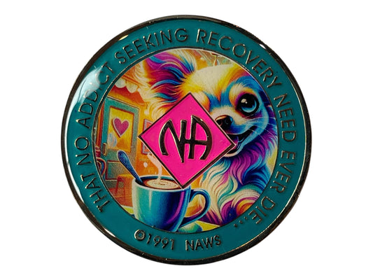 Narcotics Anonymous recovery medallion with teal border, NA diamond logo, and colorful artwork of a cheerful dog beside a coffee cup, featuring the phrase ‘That No Addict Seeking Recovery Need Ever Die.’