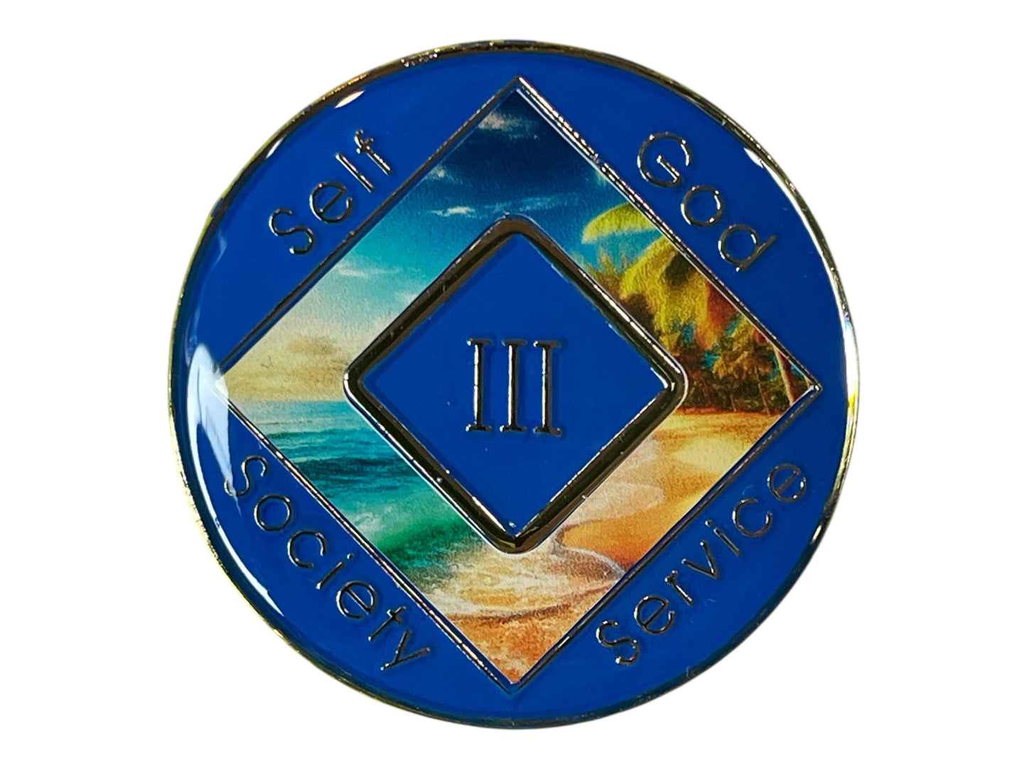 Narcotics Anonymous 3-year sobriety medallion with blue border, tropical beach and ocean wave artwork, and the words Self, God, Society, Service surrounding the Roman numeral III.