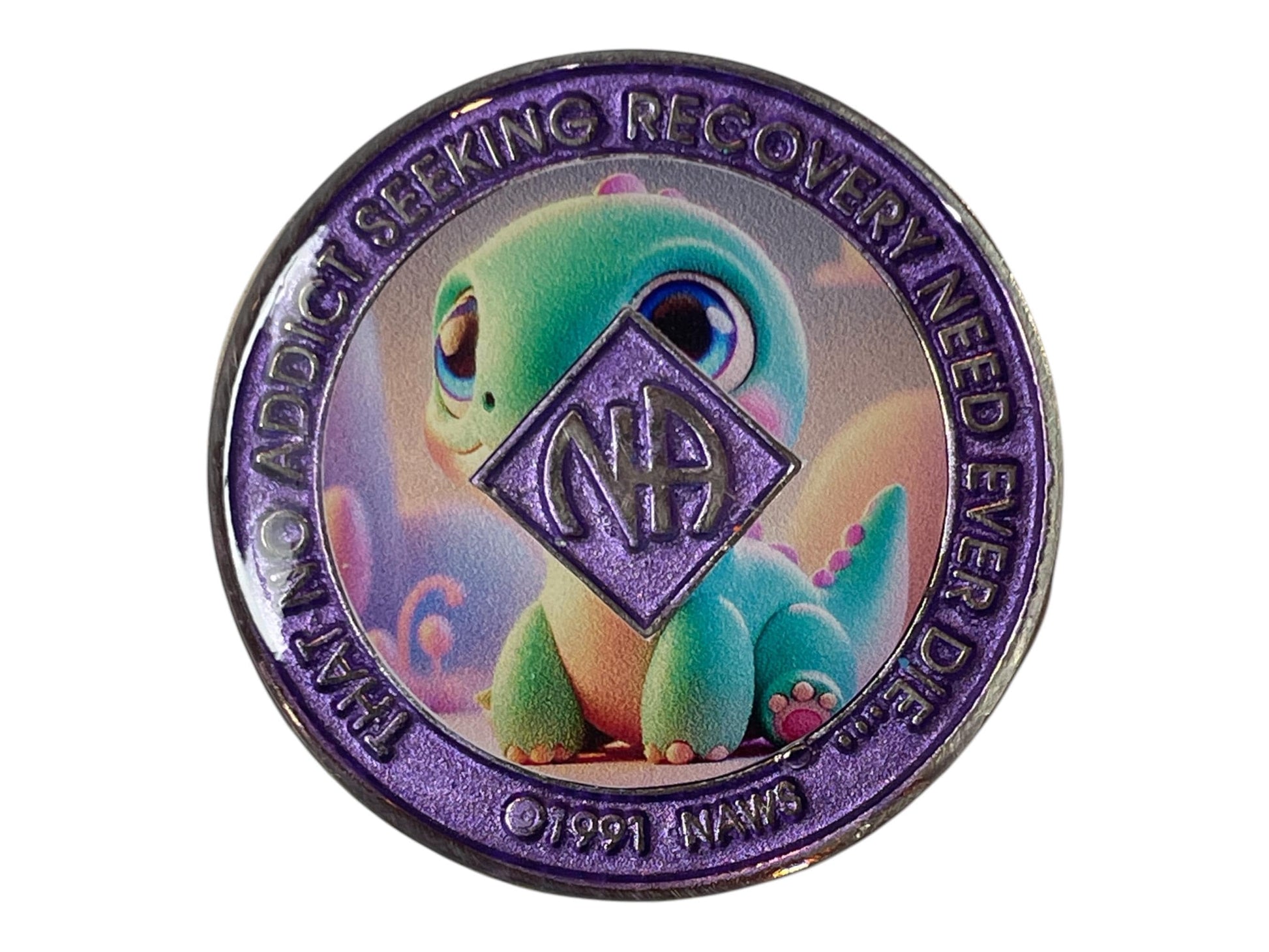Narcotics Anonymous recovery medallion with shimmering purple border, NA diamond logo, and cute baby dinosaur artwork, featuring the phrase ‘That No Addict Seeking Recovery Need Ever Die.'