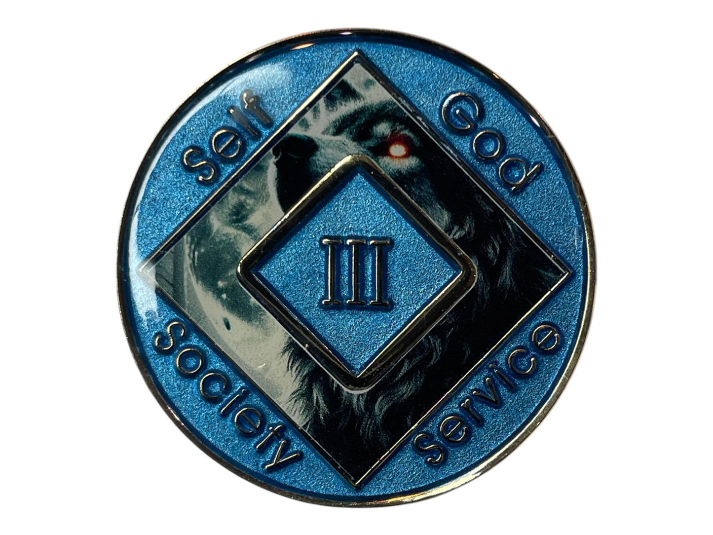 Narcotics Anonymous 3-year recovery medallion featuring a fierce wolf with glowing red eyes, symbolizing inner strength, perseverance, and transformation through recovery. The medallion has a metallic blue border engraved with “Self, God, Society, Service,” and Roman numeral III in the center, representing three years clean and the power of resilience and faith.