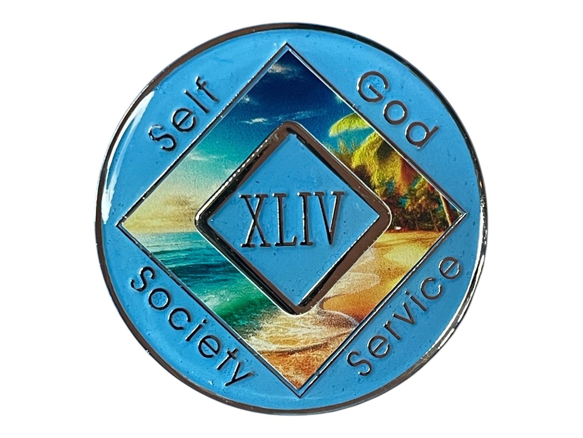 Narcotics Anonymous 44-year sobriety medallion with light blue border, tropical beach and ocean wave artwork, and the words Self, God, Society, Service surrounding the Roman numeral XLIV.