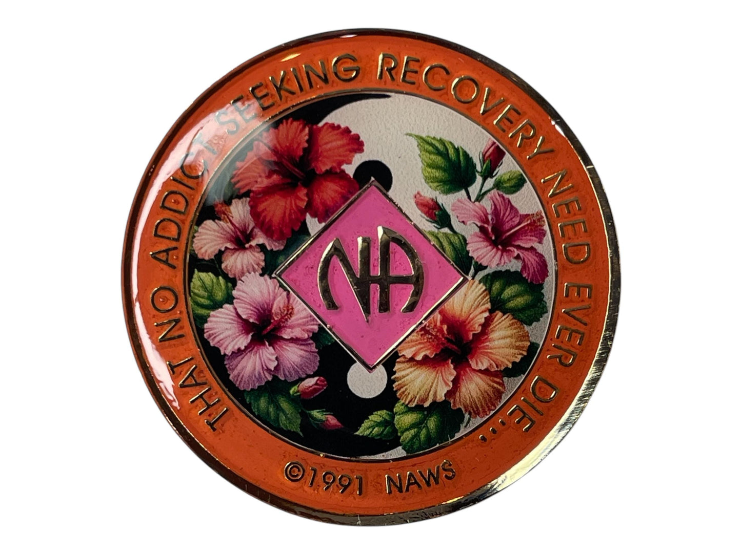 Narcotics Anonymous recovery medallion featuring a vibrant hibiscus flower design with a yin-yang background, symbolizing balance, serenity, and growth in recovery. The medallion has an orange border engraved with “That No Addict Seeking Recovery Need Ever Die,” with the NA logo centered in pink, representing healing, harmony, and new beginnings.