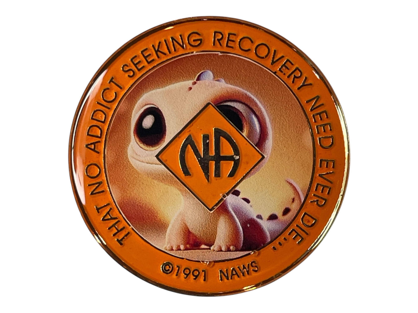 Narcotics Anonymous orange recovery medallion featuring a cute baby dragon design with the NA logo and the quote ‘That no addict seeking recovery need ever die,’ symbolizing hope, rebirth, and strength in sobriety.