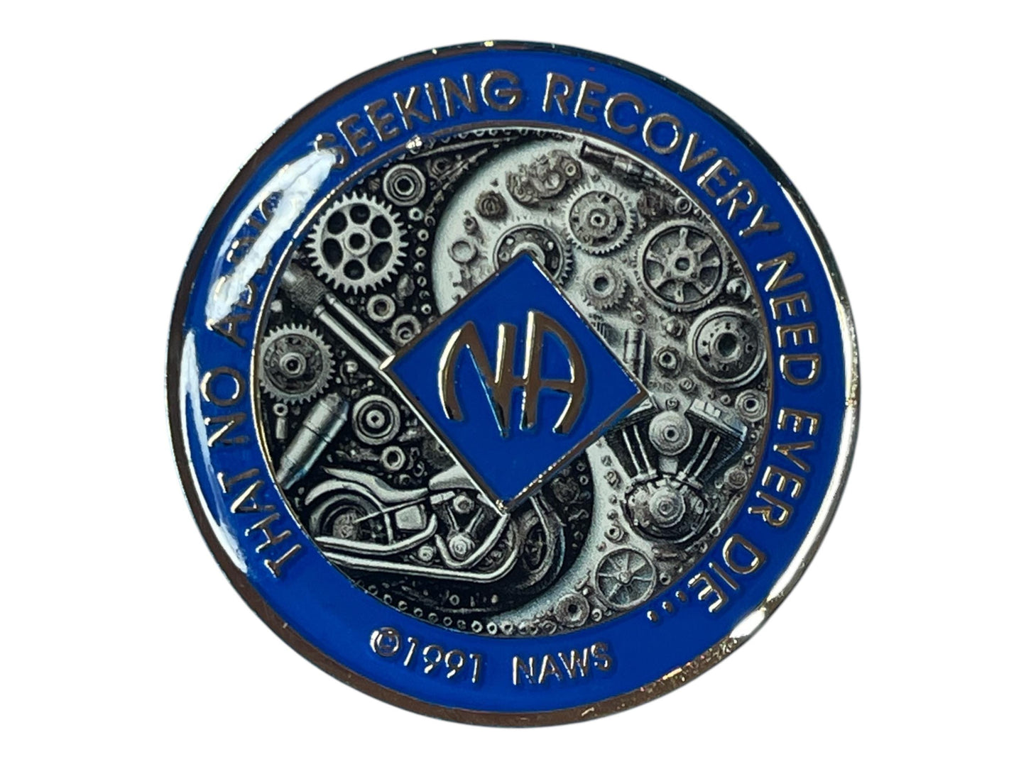 Narcotics Anonymous blue recovery medallion featuring detailed mechanical gears and motorcycle artwork with NA logo and the quote ‘That no addict seeking recovery need ever die,’ symbolizing strength, perseverance, and freedom in recovery