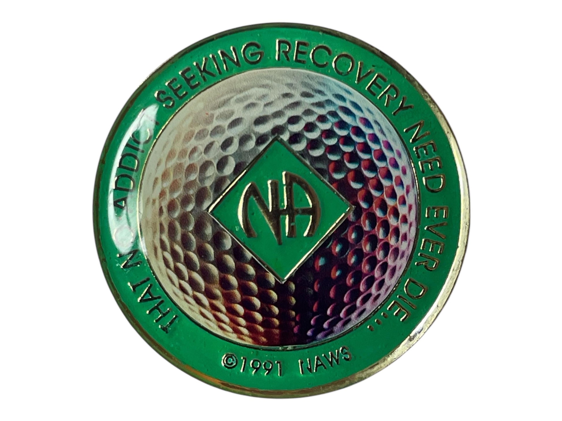 Narcotics Anonymous recovery medallion with a golf ball design, symbolizing focus, balance, and discipline in sobriety, featuring the NA logo with green enamel border and metallic detailing.