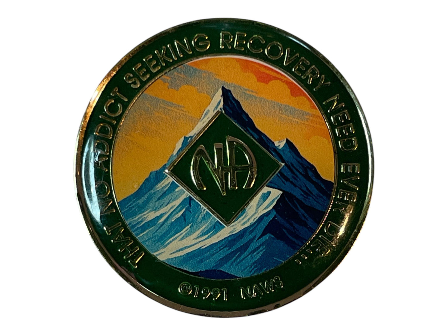 Narcotics Anonymous green recovery medallion featuring a mountain peak design with the NA logo, symbolizing strength, perseverance, and spiritual elevation in addiction recovery.