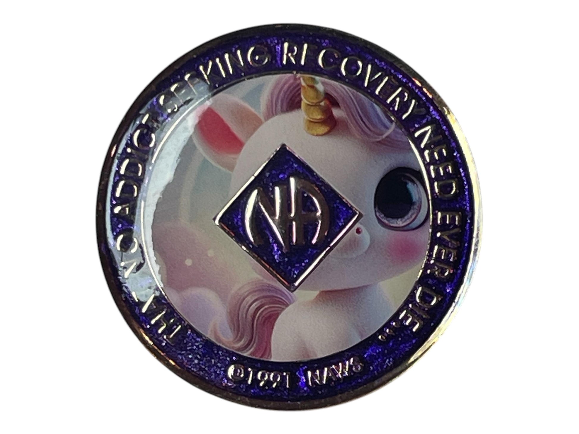 Narcotics Anonymous 4-year recovery medallion featuring a cute pastel unicorn with a golden horn, symbolizing hope, innocence, and transformation in recovery. The coin has a glittery purple background with the NA logo and Roman numeral IV in the center, surrounded by the words “Self, God, Society, Service,” representing balance, growth, and spiritual renewal on the journey of sobriety.