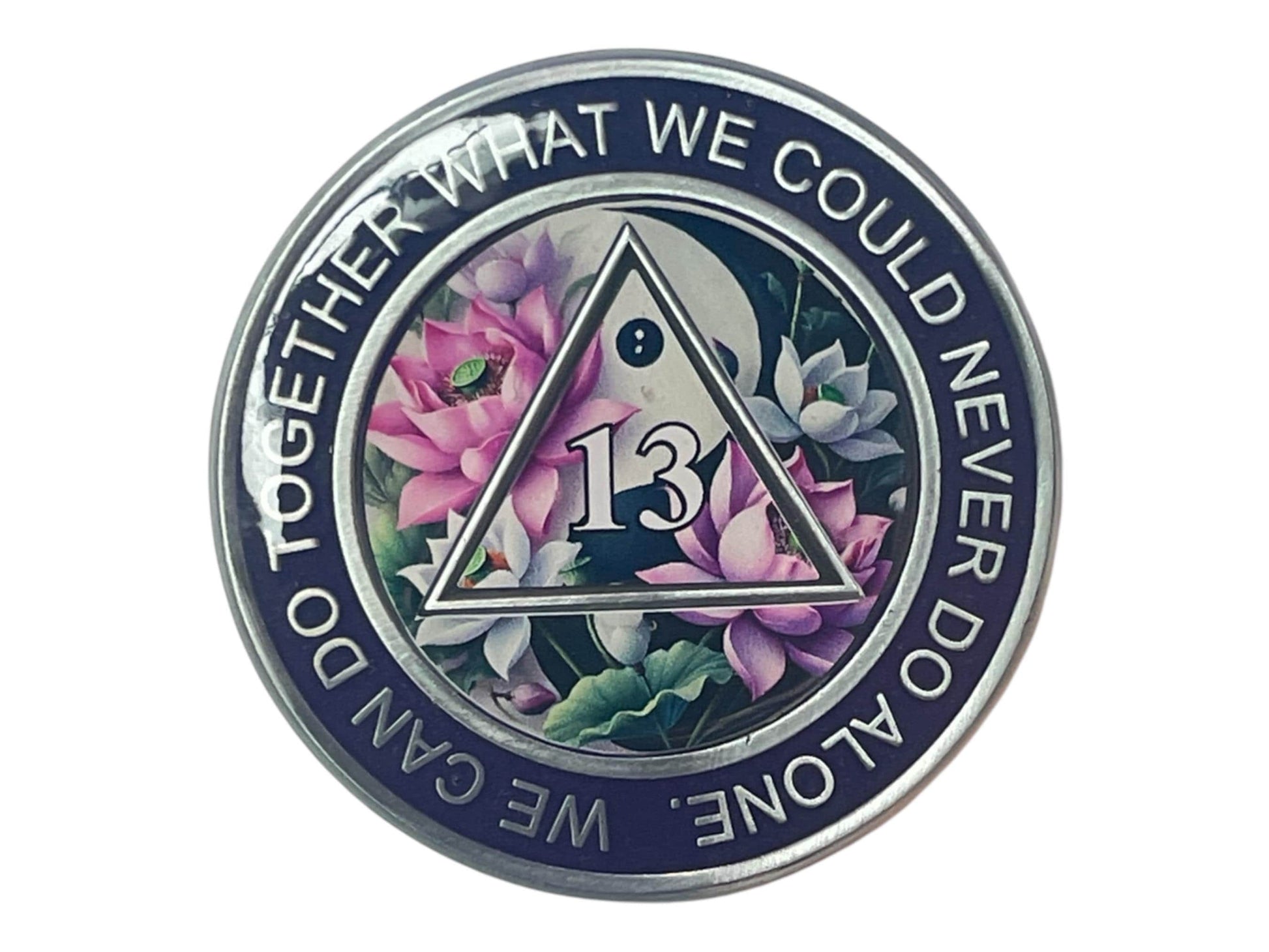 Purple AA medallion featuring a lotus flower design with the number 13 in the center, symbolizing 13 years of sobriety. Surrounded by the phrase “We can do together what we could never do alone,” this recovery coin represents growth, unity, and serenity in the journey of recovery.