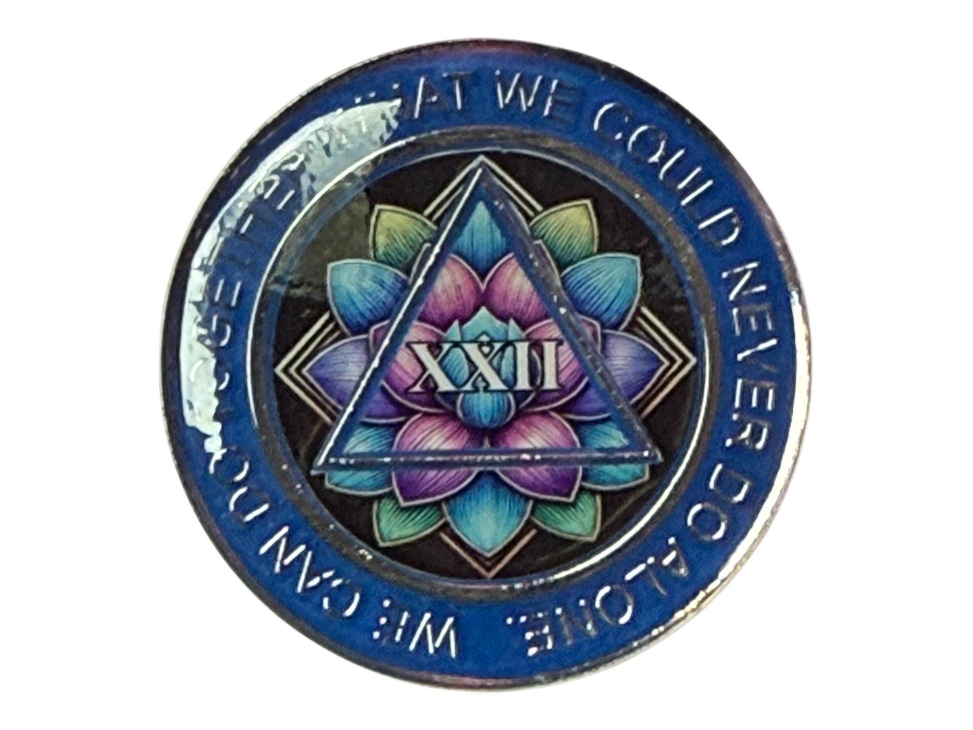AA 22-year sobriety medallion featuring a radiant lotus flower design in shades of blue, purple, and green, symbolizing spiritual awakening and renewal. The Roman numeral XXII appears within a centered triangle, representing unity, recovery, and service, surrounded by the phrase “We Can Do Together What We Could Never Do Alone” on a deep blue border.