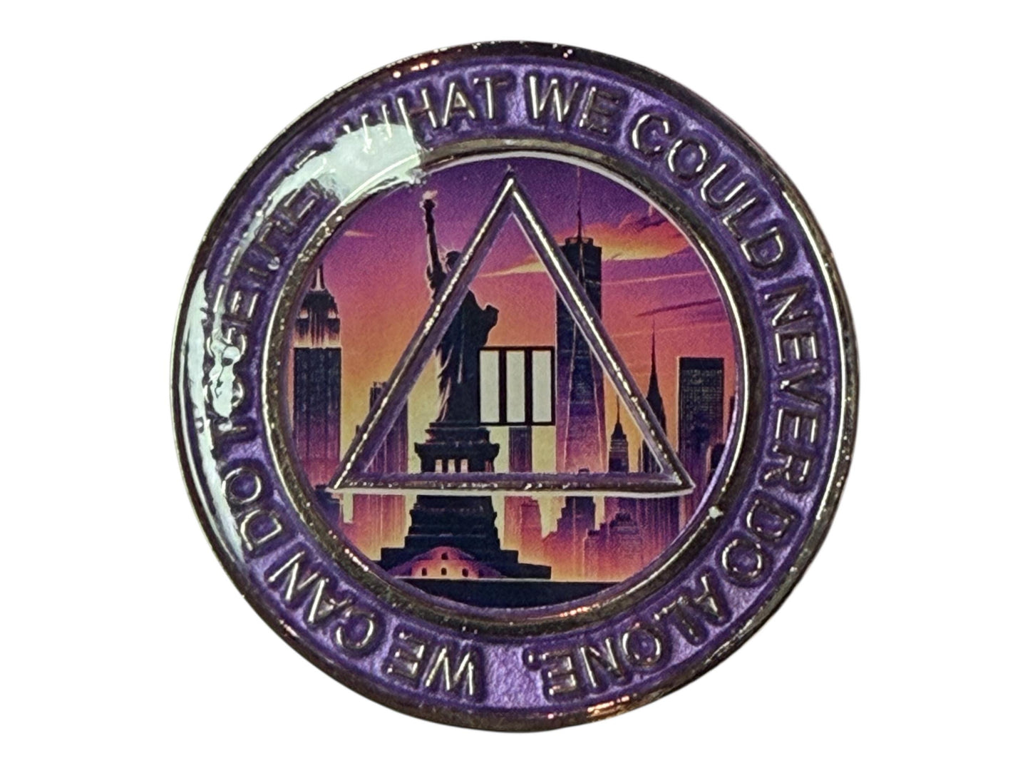 Alcoholics Anonymous 3-year sobriety medallion featuring the Statue of Liberty and New York City skyline at sunset, symbolizing freedom and hope in recovery. The coin has a purple border with the phrase “We Can Do Together What We Could Never Do Alone,” and the AA triangle logo with the Roman numeral III in the center, representing unity, recovery, and service.