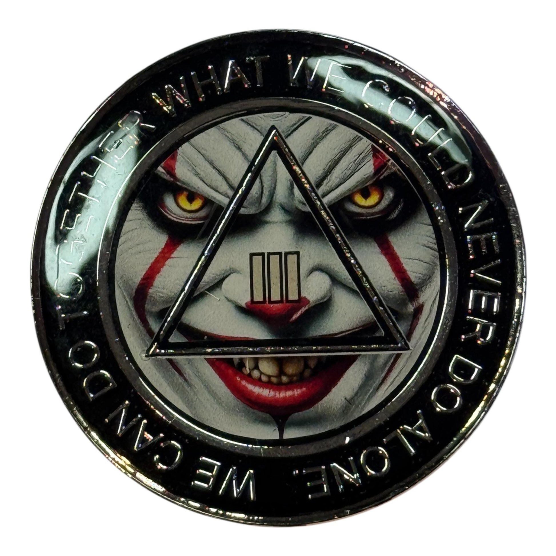 AA 3 year sobriety medallion with black border and the phrase ‘We can do together what we could never do alone,’ featuring a clown face design with yellow eyes inside the triangle and Roman numeral III.