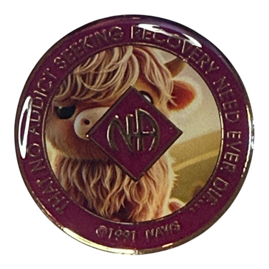 Narcotics Anonymous purple recovery medallion featuring a cute highland cow illustration with the NA logo in the center, symbolizing serenity, strength, and growth in recovery with a warm and playful design.