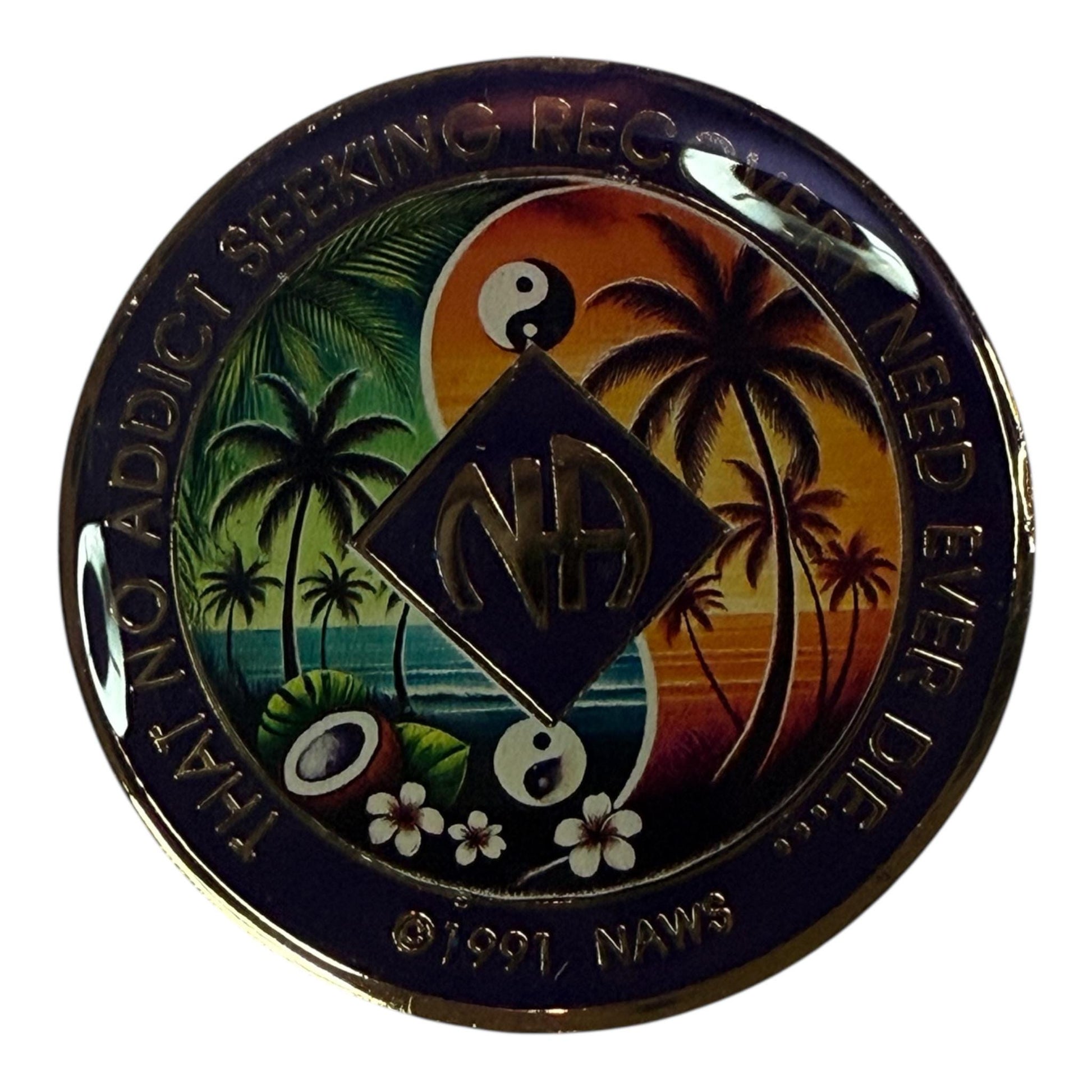 Narcotics Anonymous tropical recovery medallion featuring palm trees, ocean waves, yin-yang symbols, and coconuts under a sunset sky, symbolizing balance, serenity, and renewal in sobriety. The NA logo and phrase “That No Addict Seeking Recovery Need Ever Die” represent hope and unity in recovery.