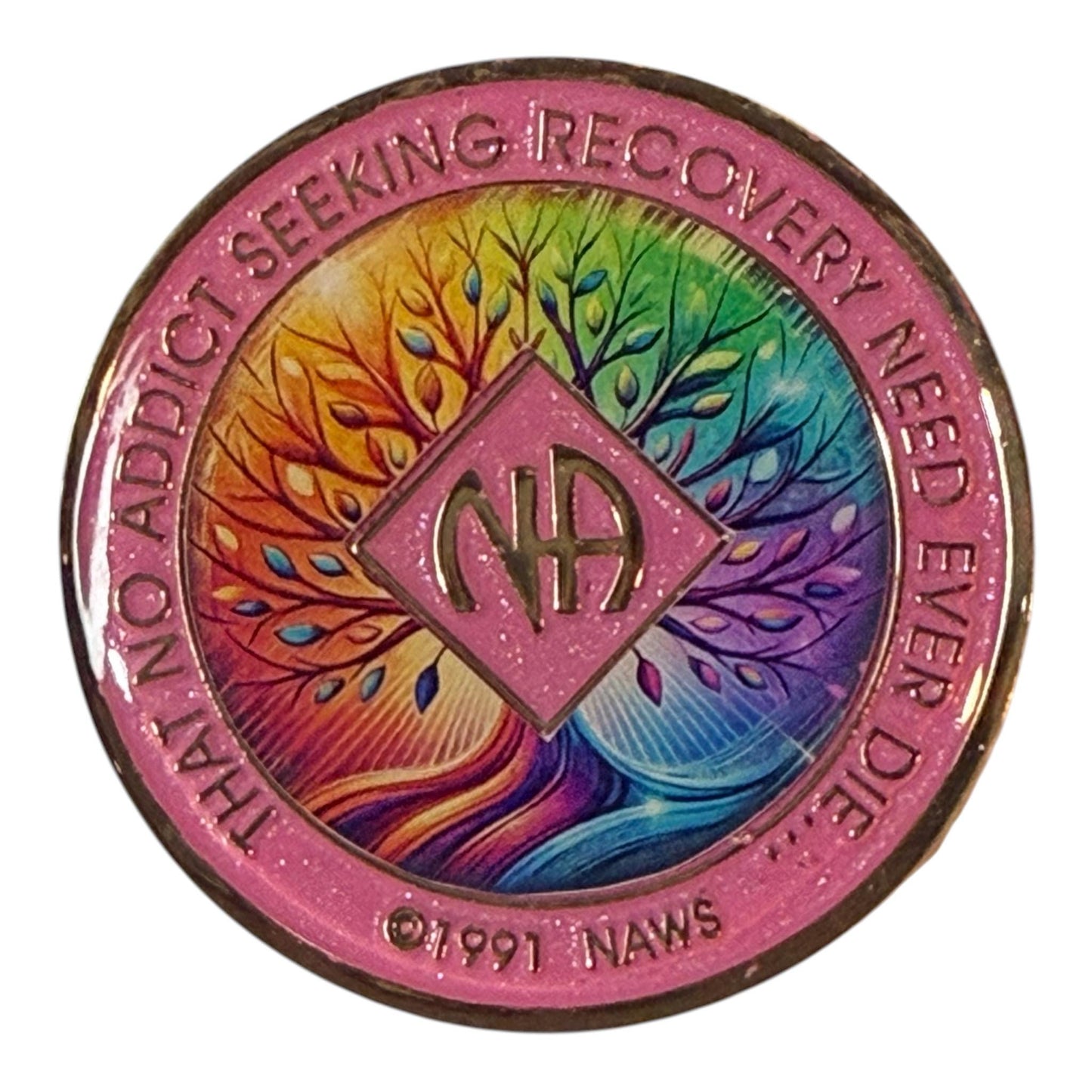 Narcotics Anonymous recovery medallion featuring a pink border and a vibrant rainbow Tree of Life design symbolizing growth, unity, and healing in recovery, with the NA logo and the phrase ‘That No Addict Seeking Recovery Need Ever Die.’