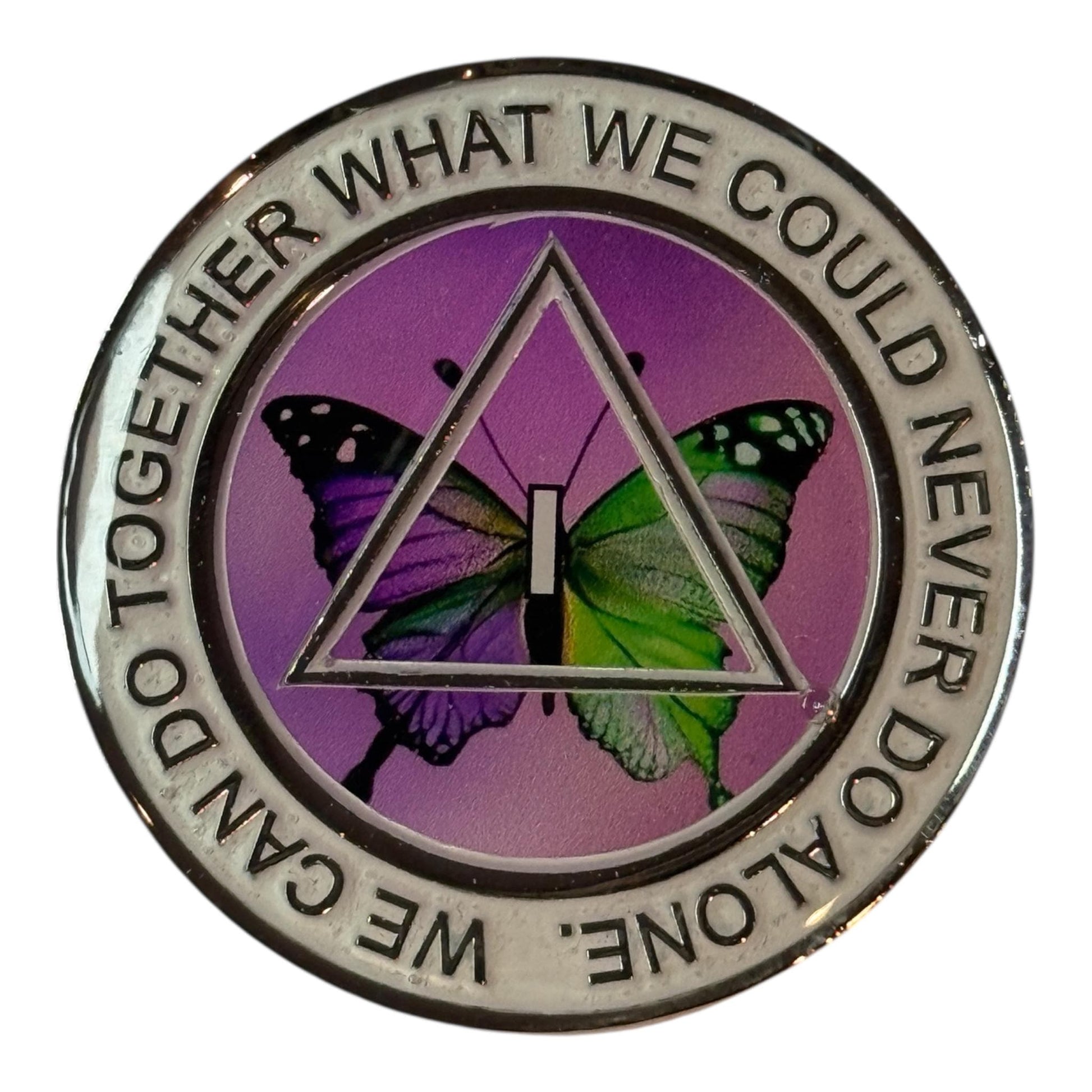 Alcoholics Anonymous 1-year sobriety medallion featuring a vibrant butterfly in shades of purple and green, symbolizing transformation, renewal, and freedom in recovery. The coin has a silver border with the phrase “We Can Do Together What We Could Never Do Alone,” and a centered AA triangle with the Roman numeral I, representing unity, recovery, and service.